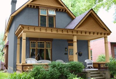 A gray craftsman home with a covered porch and green landscaping. S-W colors featured: SW 2819, SW 2813, SW 2814, SW 2807.