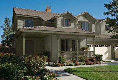 A gray craftsman home with sage green trim. S-W colors featured: SW 2821, SW 2851, SW 2846, SW 0050.