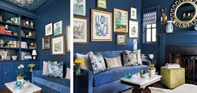 Maximalist style living room with dark blue walls, trim and sofa in front of gallery wall near built-in shelving and fireplace.