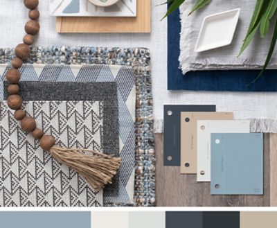 (right) blue and cream paint chips on a table with woven placemats and napkins and other wooden decor.