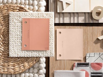 (left) pink paint chips on top of a wooden table near wicker and other fabrics.