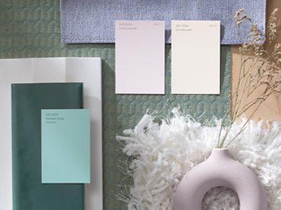 (left) lavender and blue paint chips on top of similar hued fabrics.