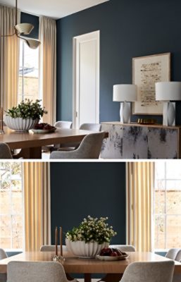Modern dining room with a wooden table, gray chairs, a floral centerpiece, and large windows with beige curtains against contrasting walls of Grays Harbor by Sherwin-Williams.