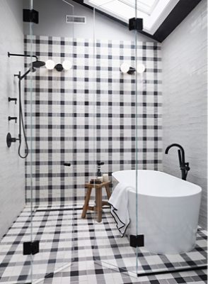 Image of two bathrooms after a transformative remodel.