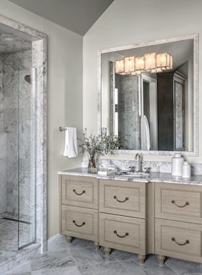 very bright bathroom with neutral vanity.