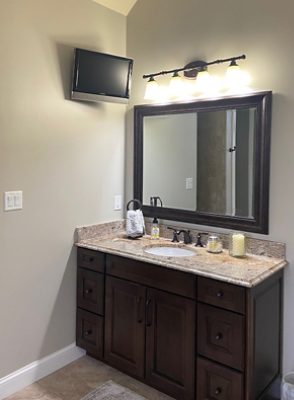 Image of two bathrooms before a transformative remodel.
