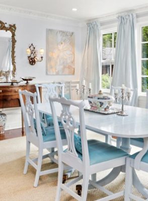 bright white dining room with lots of windows.