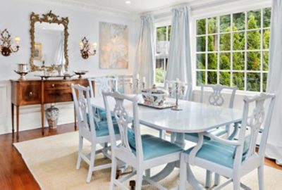 bright white dining room with lots of windows.