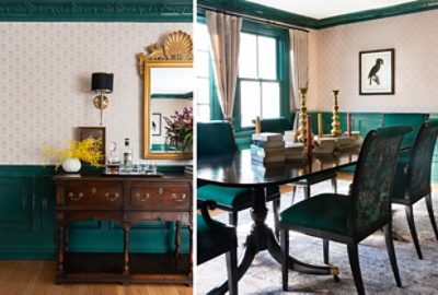 dark green dining room furniture and accents on walls with printed wallpaper.