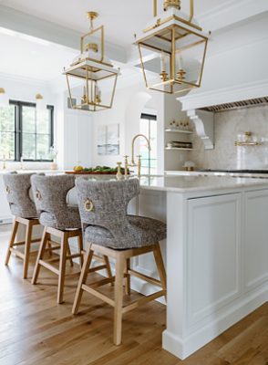 bright white kitchen with bar/stools.