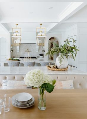 bright white kitchen with bar/stools.