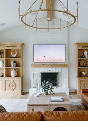 bright white living room with fireplace.