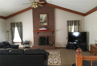 before photo of living room with dark features.