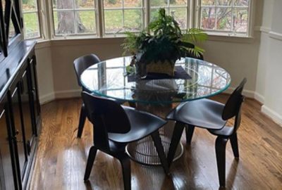 before photo of kitchen with clear table and dark chairs.