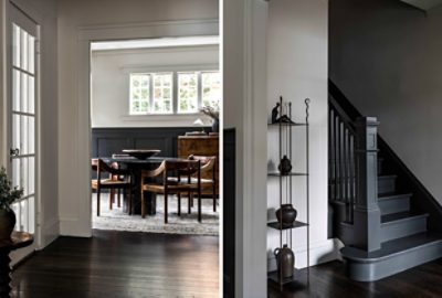 peek into a dining room with table and chairs and view from the bottom of a staircase.