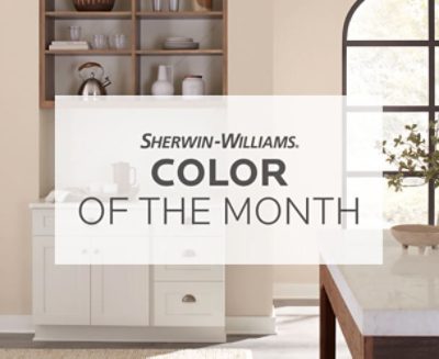 Sherwin Williams Color of the Month text over a living room with Sand Dollar SW 6099 painted on the walls.