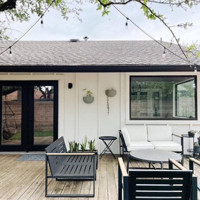 A patio deck with modern furniture. S-W featured colors: SW 7004, SW 7069, SW 6258.