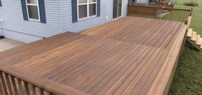 A wooden backyard patio deck.