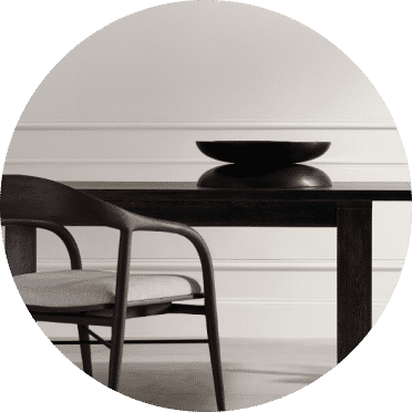 A black table with a chair.