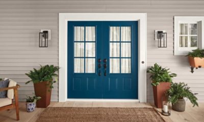 Double front doors painted blue.