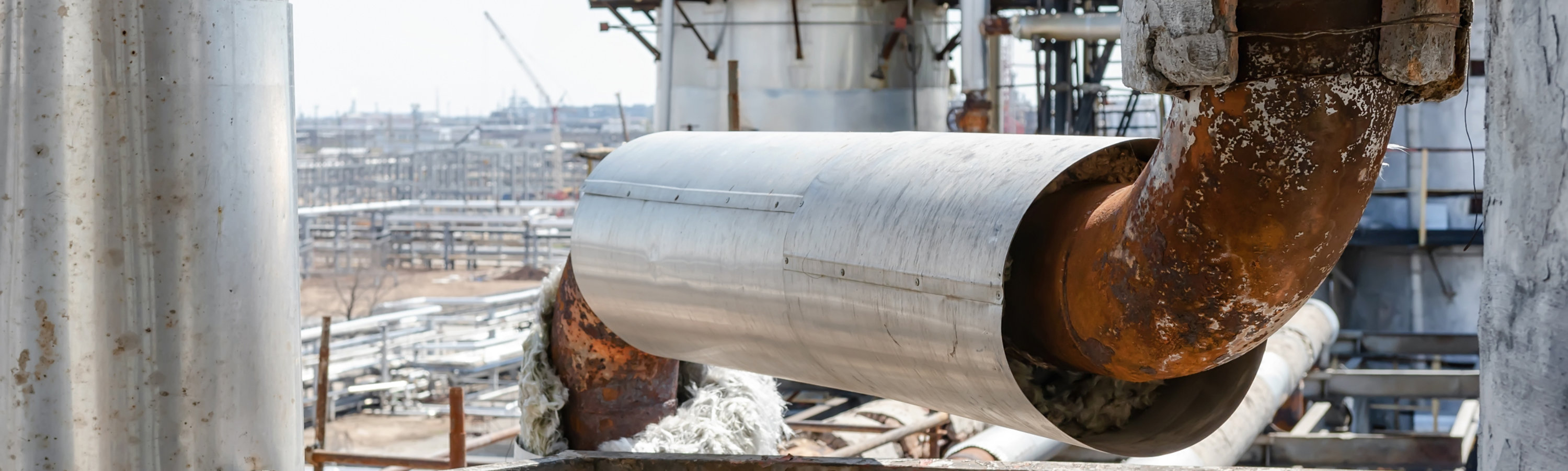 Image of an insulated pipe with rust formation