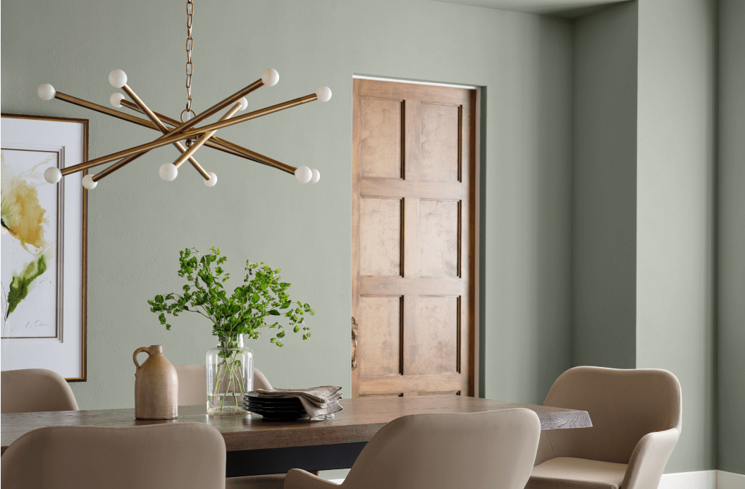 Modern dining room painted Sherwin Williams 2020 color of the year SW 9130 Evergreen Fog.