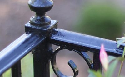 A black exterior metal railing. 