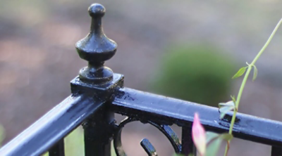A freshly painted black exterior railing