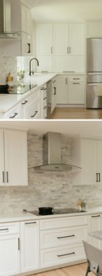 A modern kitchen with Cotton white cabinets, black hardware, light wood floors, stainless steel appliances, and variegated gray tile backsplash. 