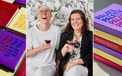 Colorful books with "PALATE PALETTE" on covers, Lish Steiling and Abbey Cook smiling with drinks, and a stack of their Palate Palette cookbooks.