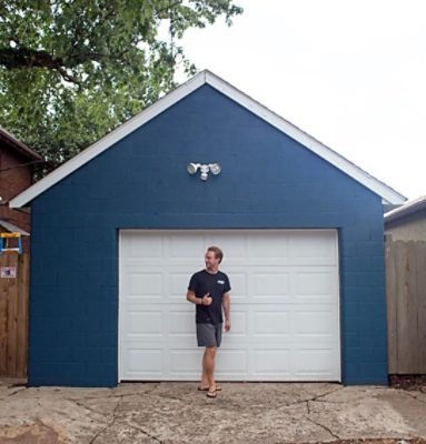 A freshly painted dark blue garage