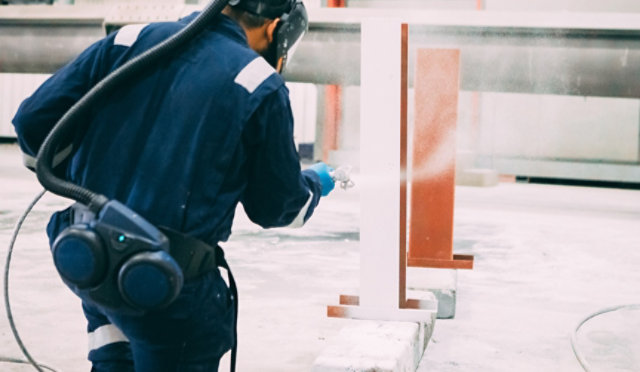 Fire protective coatings being applied