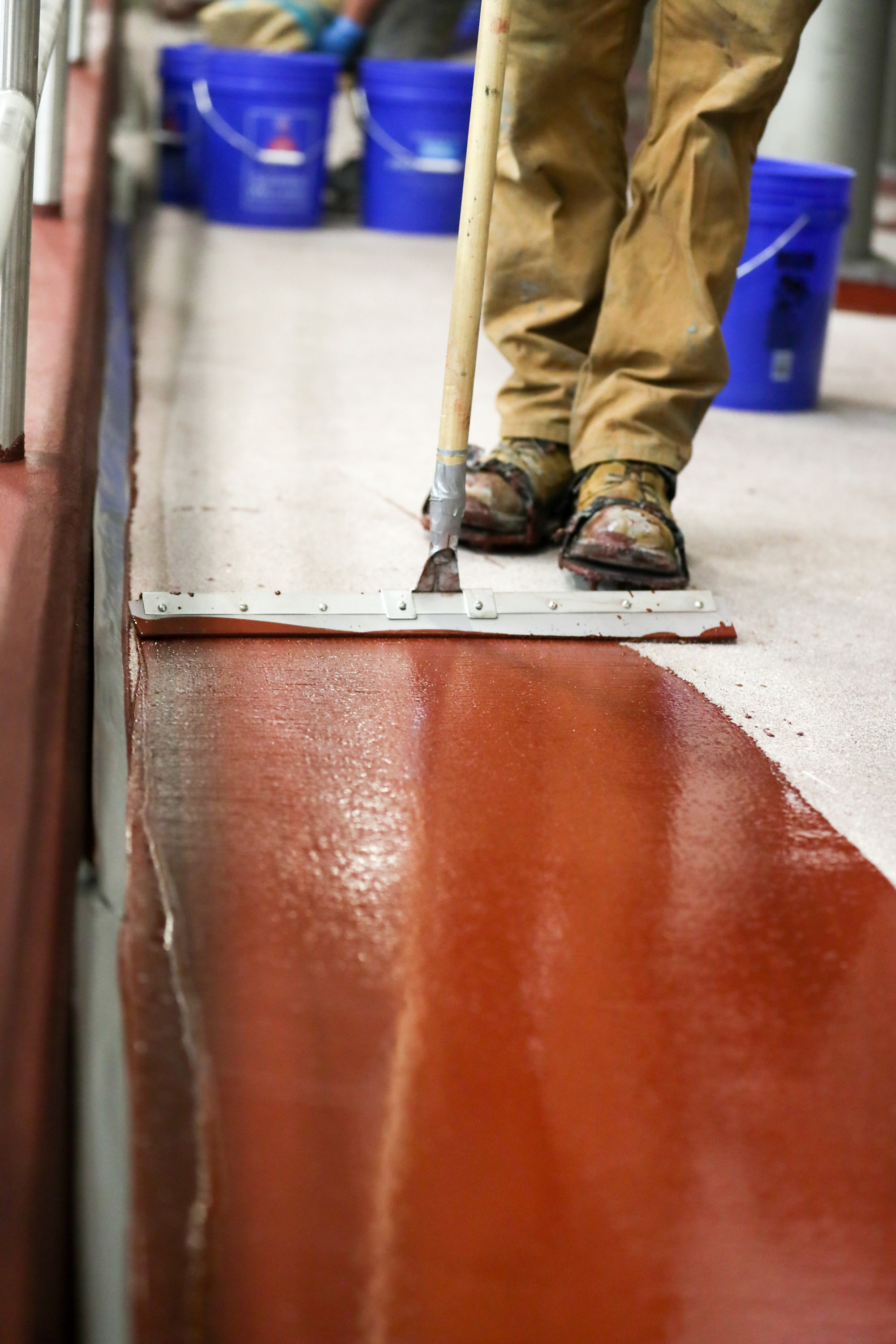 resinous floor application with squeegee