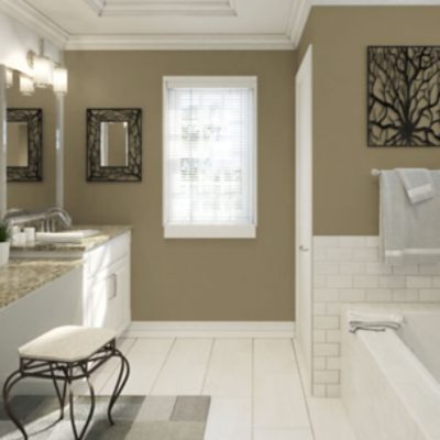 A bathroom with walls painted green.