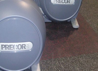 A Precor elliptical on rubber tiles.