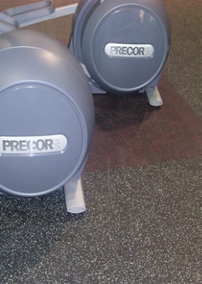 A Precor elliptical on rubber tiles.