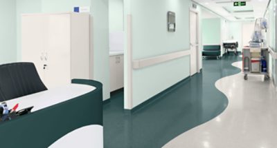 A hospital reception area with painted walls and floors.