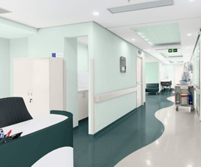 A hospital reception area with painted walls and floors.