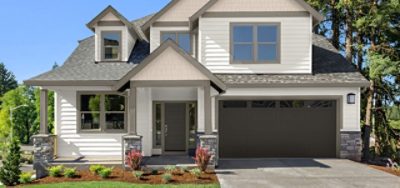 House exterior with grey stone, dark grey garage door and white siding.