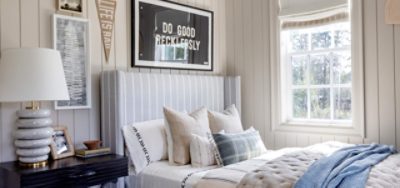 A bedroom with painted paneling.