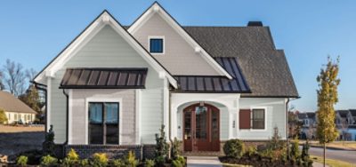 An exterior photo of a white vinyl siding house.