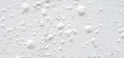Up close of a surface with bubbling paint.
