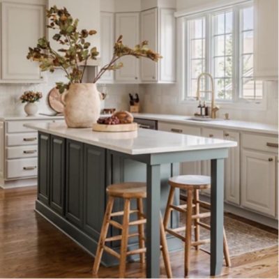 Bright white kitchen cabinets with windows, decor, island with bar stools, by @macfarland_painting.