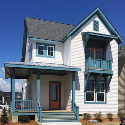 A white home exterior with blue trim. S-W featured color: SW 6228 Refuge. Photo credit @saussyburbank.
