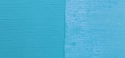Light blue frosting paint on a wooden surface.