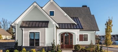 An exterior photo of a white vinyl siding house.