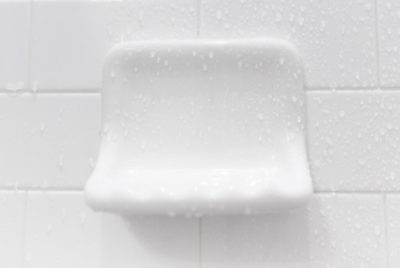 Close-up of a clean soap holder in a shower, free of mildew.