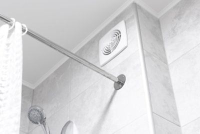 A clean shower ceiling free of mildew, with a smooth, white surface and no visible stains or moisture damage.