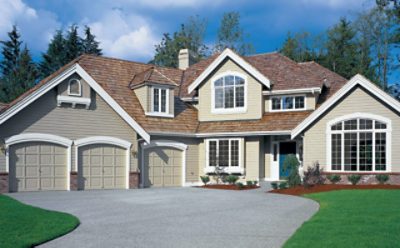 A house with a newly stained driveway.