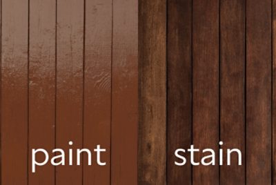 A side by side of painted wood fencing and stained wood fencing.